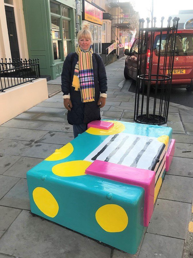 Tina Dempsey with her new bench, now installed at Edward Street off Cedar Square