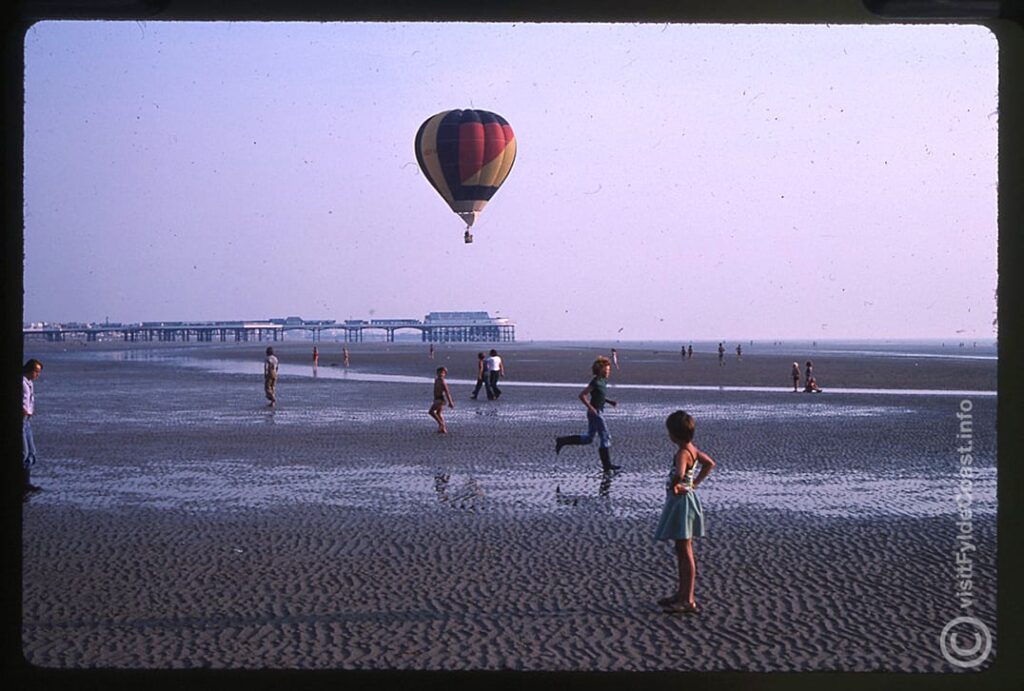 Hot air balloons taking off from Blackpool beach in the 1970s