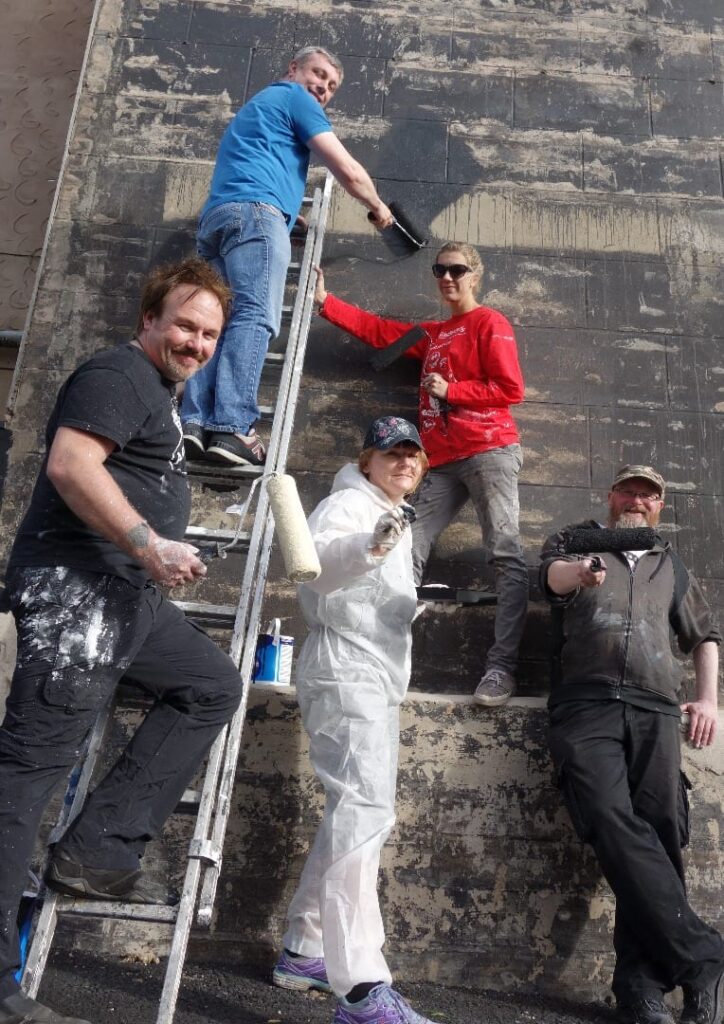 Preparing one of the walls for Sand Sea & Spray are (left to right) David Hirst, Cllr Mark Smith, Beata Kuczynska, Michelle Minett and John Allen.