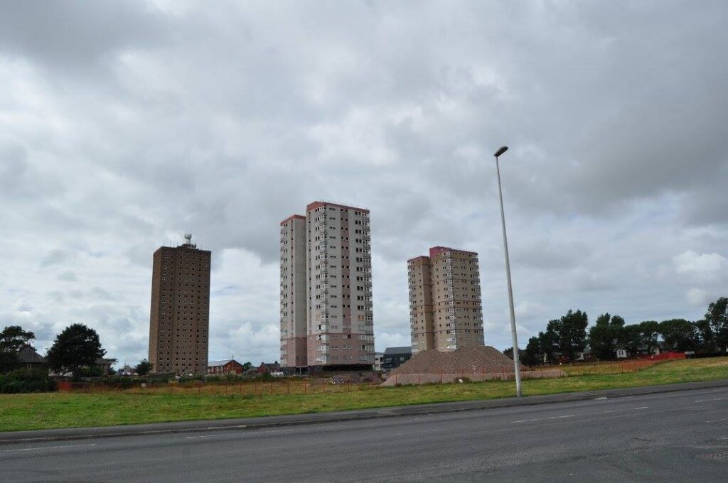 Three tower blocks at Queens Park flats, just before demolition on 31.7.16. Photo: Juliette Gregson