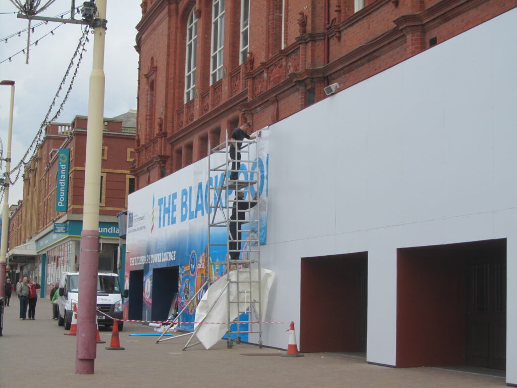 Boarded facade for the Blackpool Tower Conservation work gets a facelift. May 2013