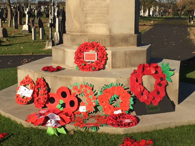 Knitted poppies displayed at Layton Cemetery in 2016