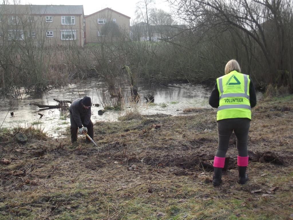Volunteers clearing one of the ponds