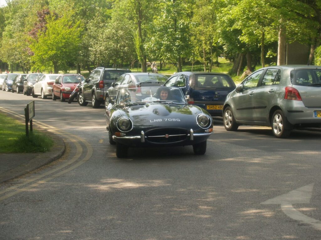 John Barnett, Chairman and Founder of Radio Wave, in his E Type Jaguar