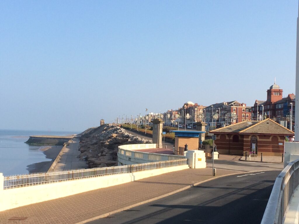 Blackpool seafront at Gynn roundabout, looking north. Public toilets with the blue roof, almost centre shot.