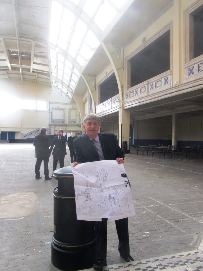 Jon Conway with his plans for Illuminasia, in August 2013