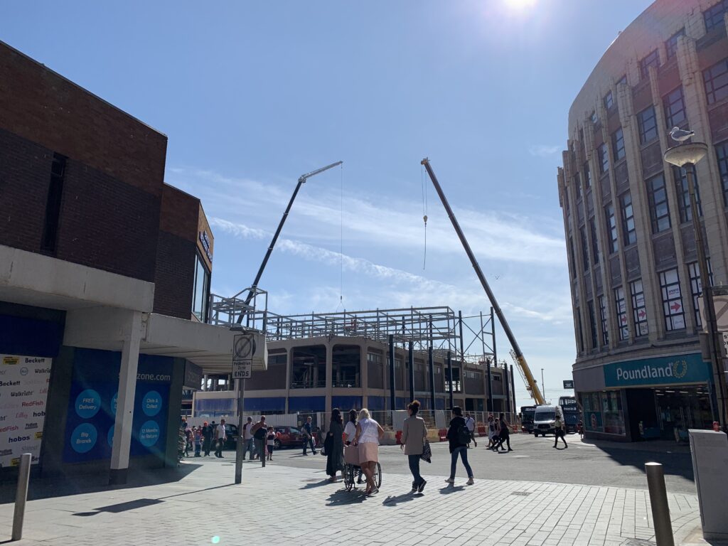 Big cranes on site to install steelwork in August 2019