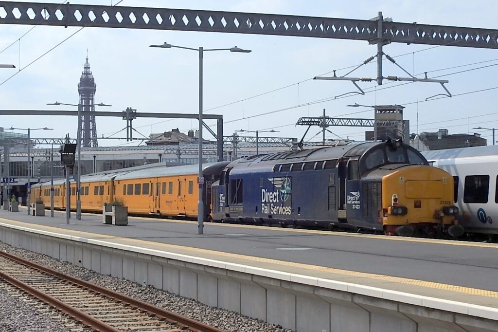 General view of the special train at Blackpool North with the iconic tower in the background, this locomotive is 37423 named "Spirit of the Lakes"