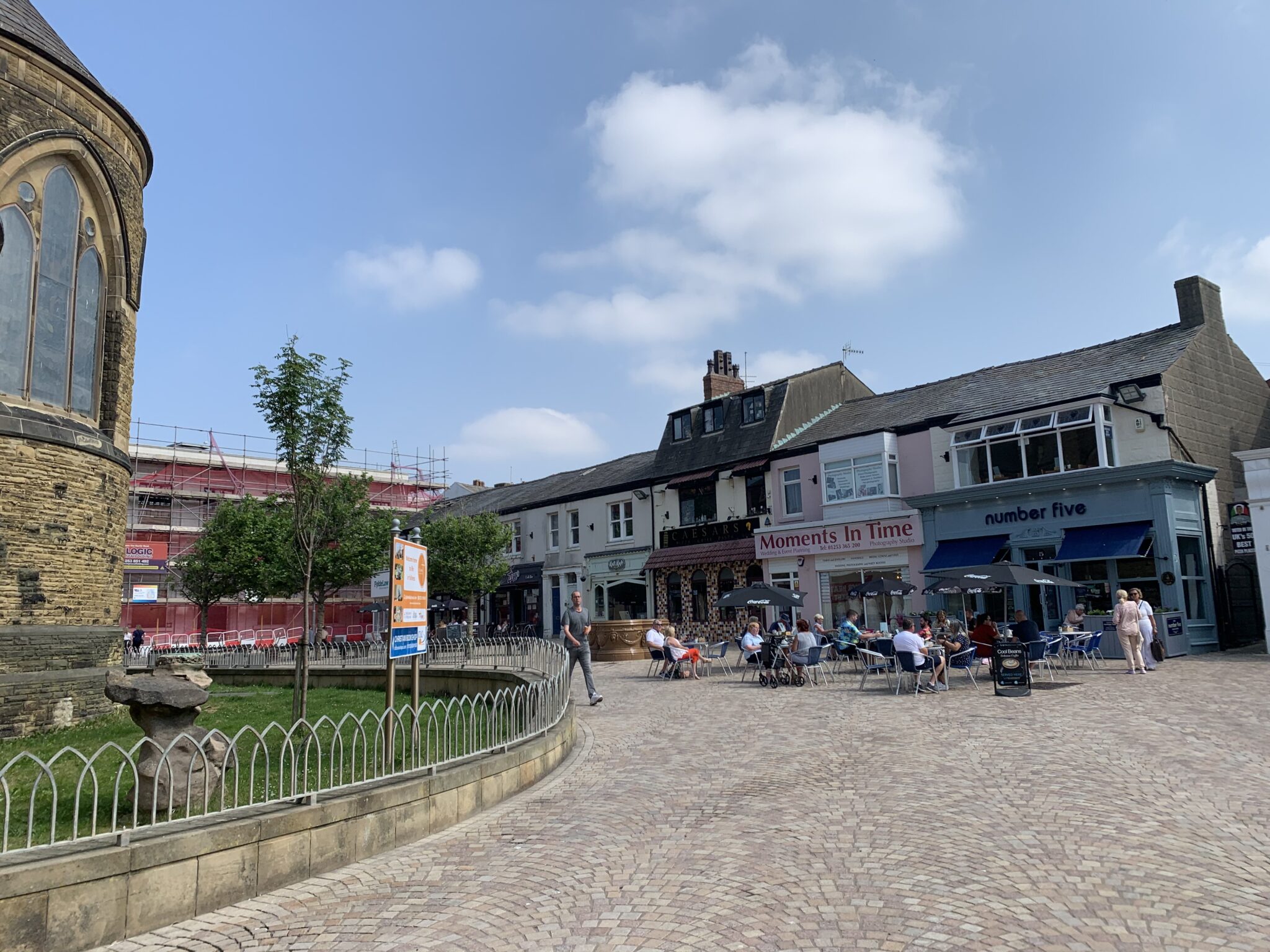 Cedar Square, with St John's Church just visible at the left and Cedar Tavern in the background