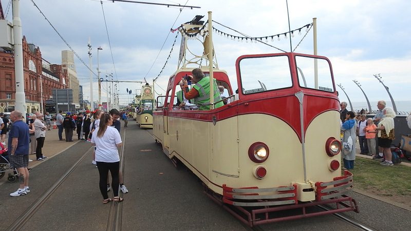 With the parade now in full swing boat No. 227 pauses at the head of the line of twelve heritage trams alongside the Comedy Carpet in the shadow of the famous Blackpool Tower.