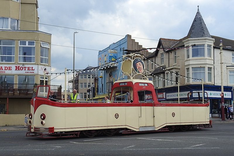 No. 227 is one of the unique Blackpool open boats, now named ‘Charlie Cairoli’ after the famous Blackpool circus Clown, creeps across the promenade road from Lytham Road to join the main tram lines.