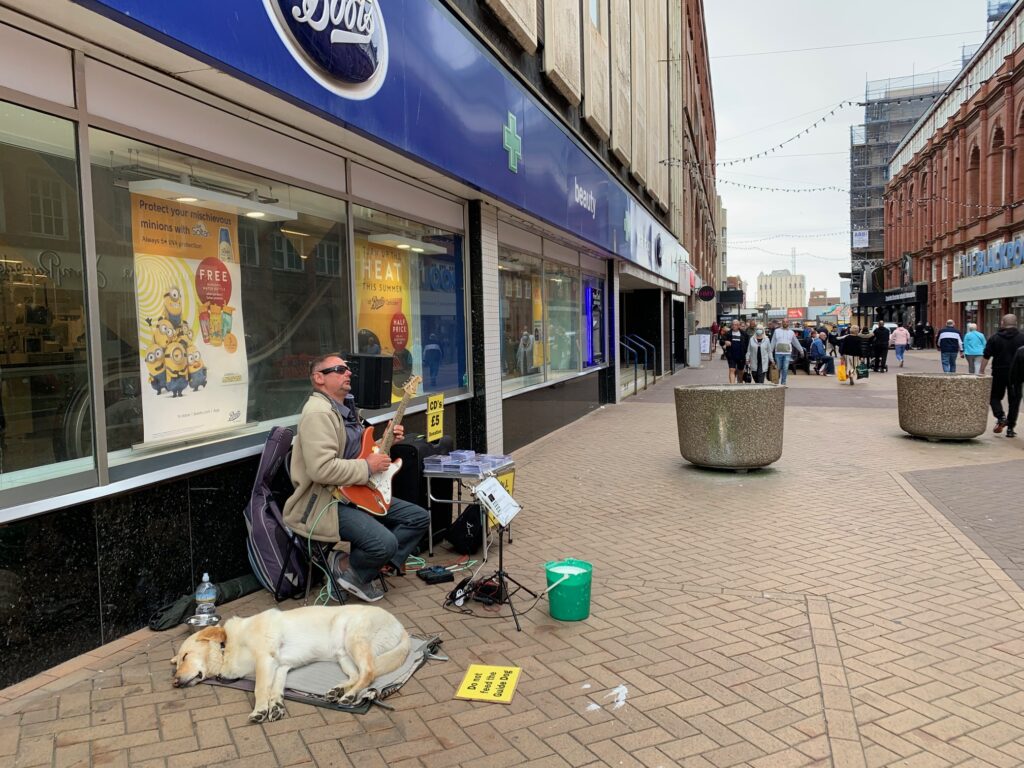 Next corner heading south - Andy plays outside Boots