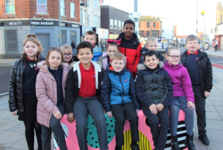 Children from St John's Primary with their 'Fancie' bench